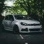 white bmw m 3 coupe parked on black asphalt road during daytime