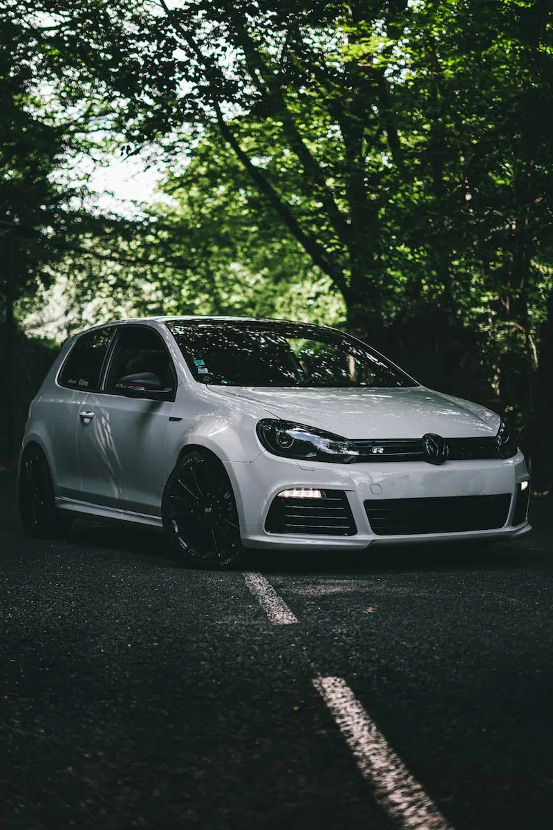 white bmw m 3 coupe parked on black asphalt road during daytime